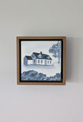 Front view of Abide, a minimalist monochrome watercolor study of a coastal home, isolated within a deep light walnut float mount frame on a neutral wall.