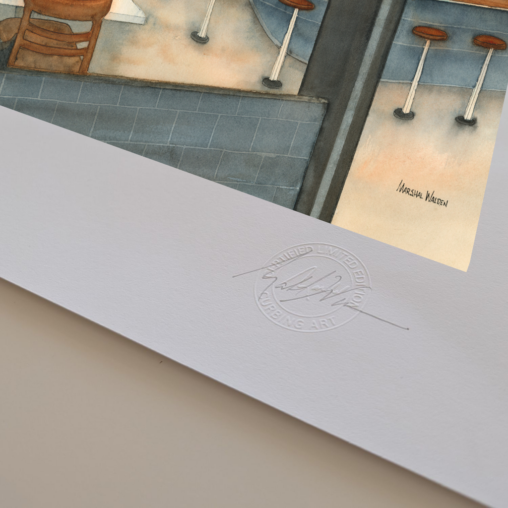A macro photograph of the bottom corner of the limited edition fine art print "Anybody's Bar." The image highlights the textured surface and visible thickness of the heavyweight archival paper stock. Visible on the white border are the raised, circular Curbing Art Certified Limited Edition embossed seal and artist Marshal Walden's hand-signed signature in graphite pencil.
