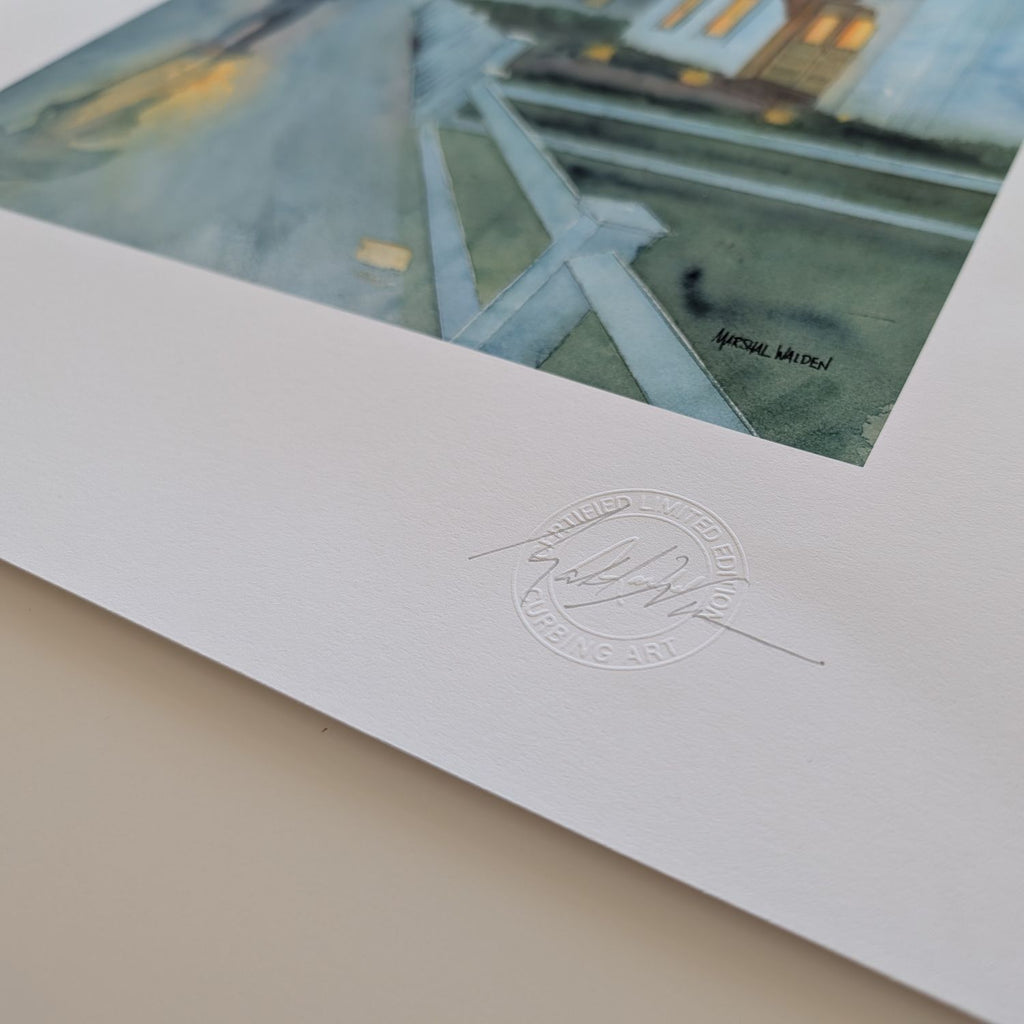 A macro photograph showing the lower corner details of the limited edition fine art print "Stroll In Rain." The focus is on artist Marshal Walden's signature written in graphite pencil next to the raised, circular official "Curbing Art" studio embossing seal pressed into the surface. The lighting and close perspective emphasize the deep texture, tooth, and substantial thickness of the heavy archival paper stock.