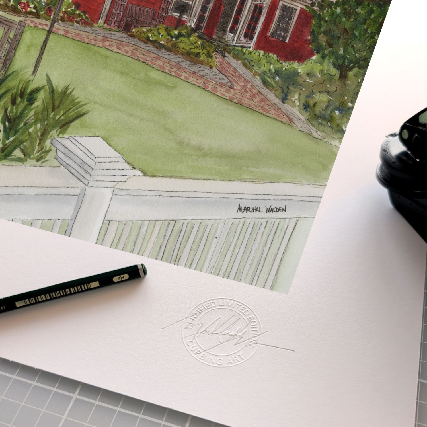 A detailed close-up photograph showing the authentication elements on the border of the limited edition fine art print "Red Inn." The focus is on the official, raised circular "Curbing Art" studio embossing seal pressed into the surface of the textured fine art paper. Resting beside the seal are the artist's graphite pencil used for signing and numbering, and the metal hand-embossing tool.

