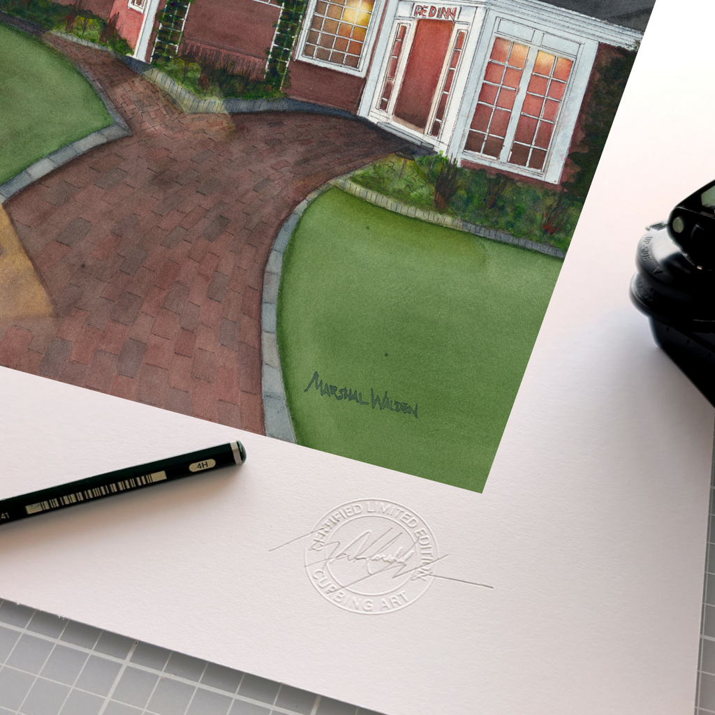 A detailed close-up photograph showing the authentication details on the border of a limited edition fine art print of "Red Inn Summer Glow." The focus is on the official, raised "Curbing Art" studio embossing seal pressed into the paper. Resting beside the seal are the artist's graphite pencil used for signing and numbering, and the metal hand-embossing tool. The texture of the fine art paper is clearly visible.
