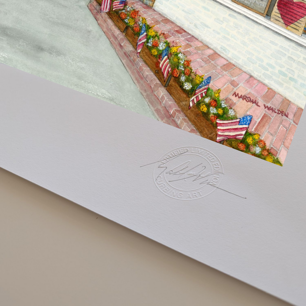 A macro photograph of the bottom corner of the limited edition fine art print "Window With A View." The image highlights the textured surface and visible thickness of the heavyweight archival paper stock. Visible on the white border are the raised, circular Curbing Art Certified Limited Edition embossed seal and artist Marshal Walden's hand-signed signature in graphite pencil.