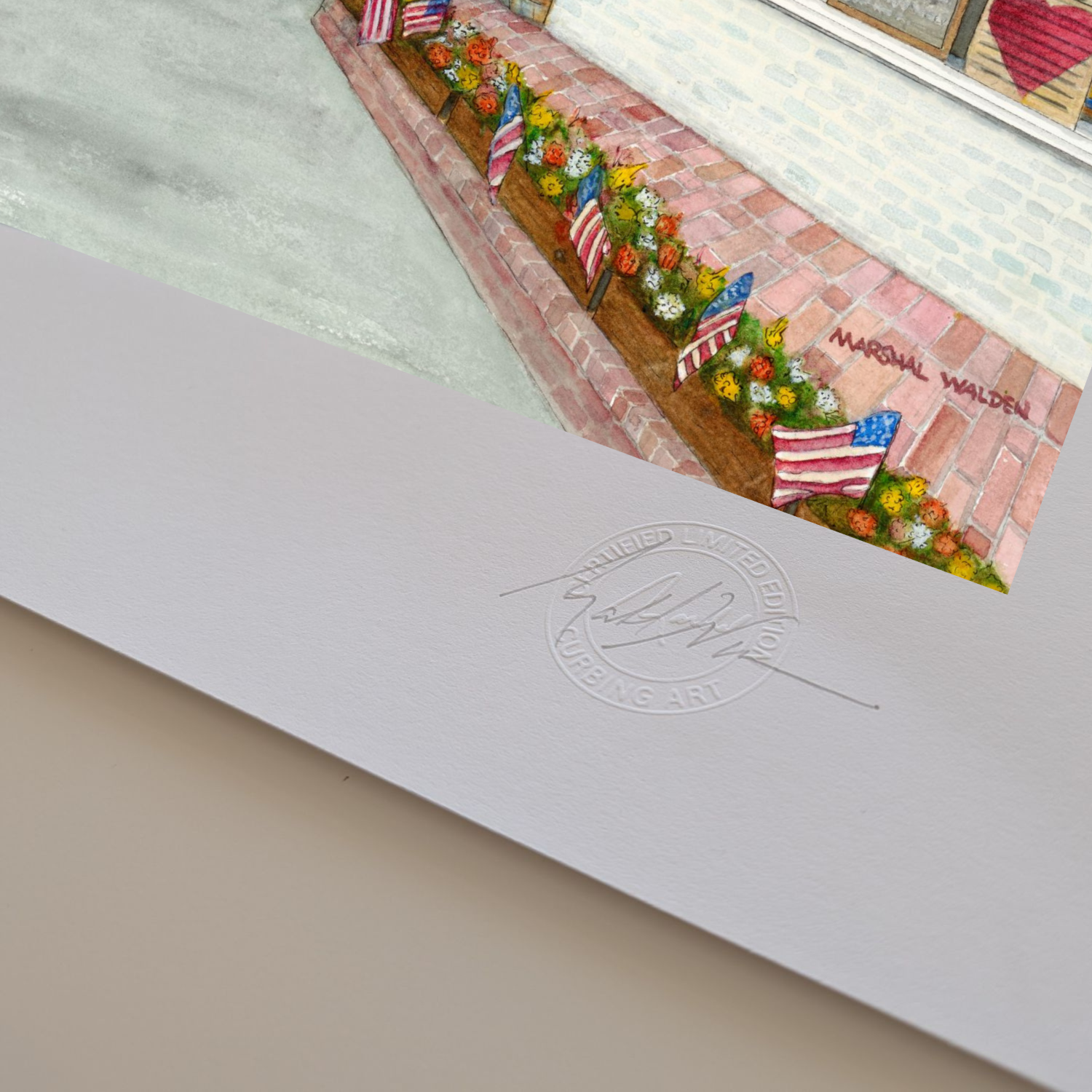 A macro photograph of the bottom corner of the limited edition fine art print "Window With A View." The image highlights the textured surface and visible thickness of the heavyweight archival paper stock. Visible on the white border are the raised, circular Curbing Art Certified Limited Edition embossed seal and artist Marshal Walden's hand-signed signature in graphite pencil.